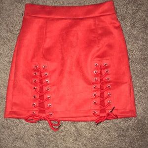Red Skirt with lace up detail.